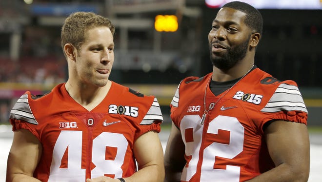Adolphus Washington, right, is a Taft High School alumnus and started at Ohio State for three years. He is expected to be selected in the NFL Draft in 2016.