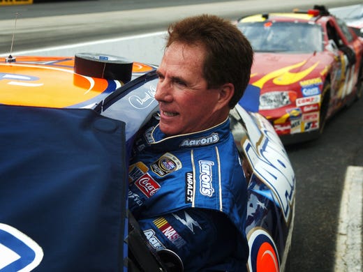 Darrell Waltrip gets into his car before the NASCAR