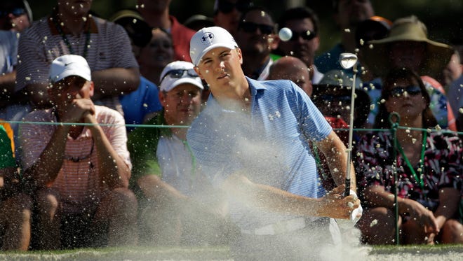 Jordan Spieth watches his hit out of a bunker at the seventh hole during the third round of the Masters golf tournament Saturday in Augusta, Ga.