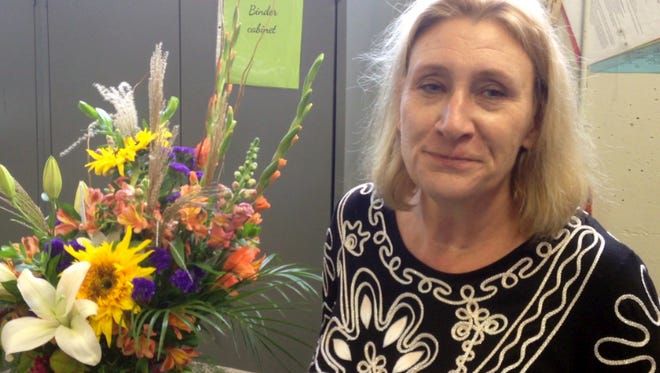 E. Kyle Robinson operated her own florist shop before becoming a teacher 15 years ago.
