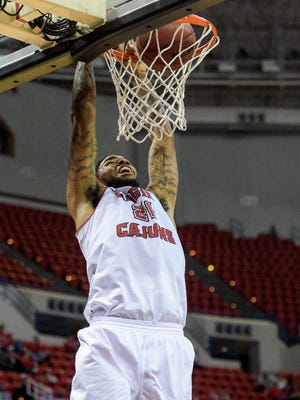 UL's Shawn Long (21), shown here dunking against McNeese State earlier this season, is t tied for fifth on the Cajuns' career scoring leaders list. Wednesday, Dec. 9, 2015.