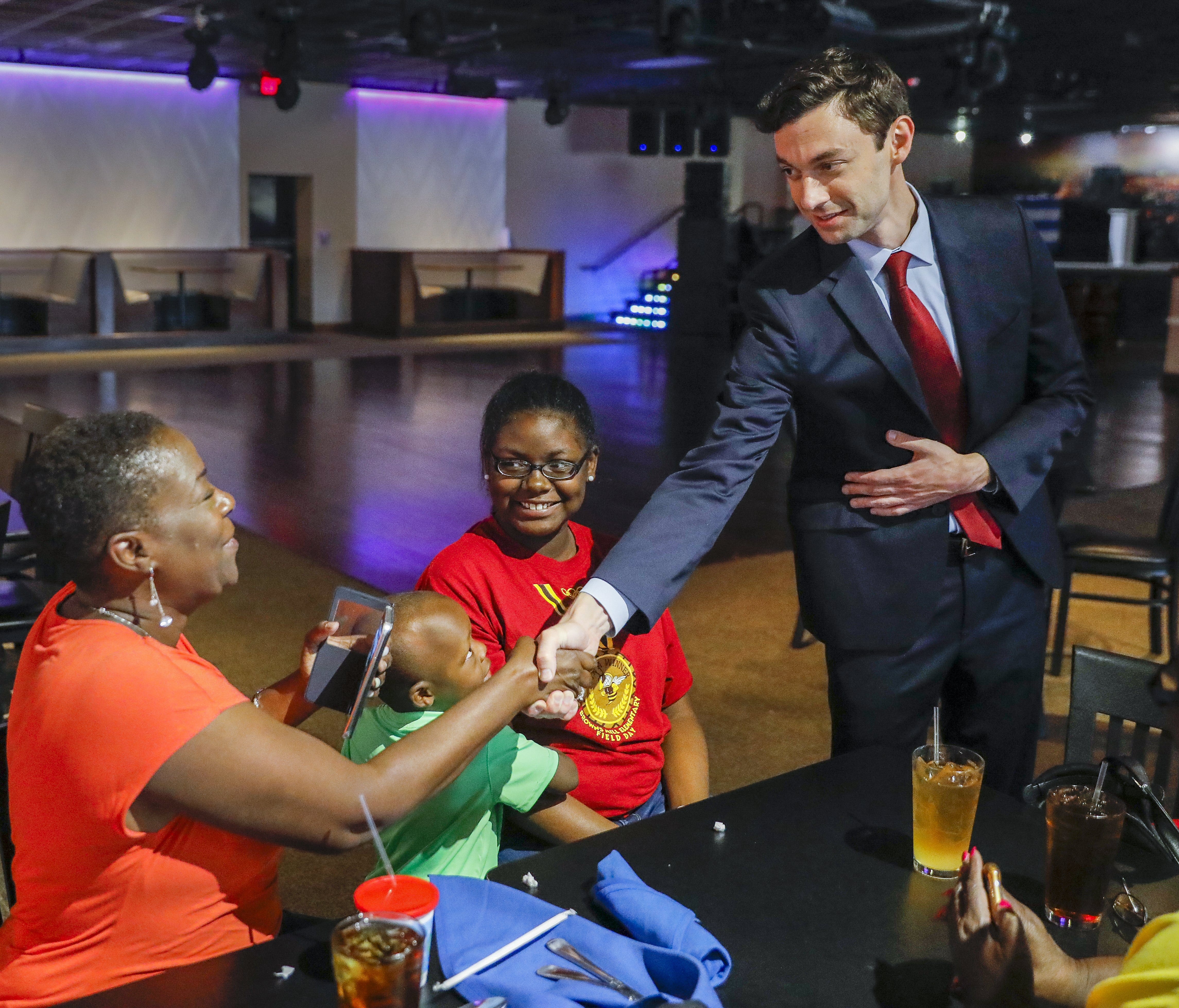 Democratic congressional candidate Jon Ossoff campaigns at a restaurant in Tucker, Ga. Ossoff faces Republican candidate Karen Handel in a closely watched special election Tuesday.