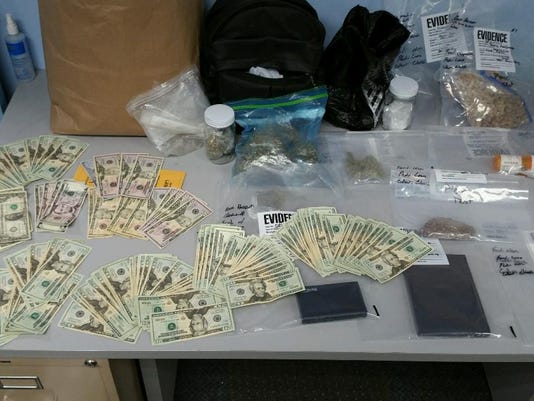 Marijuana, cash seized in barbershop raid