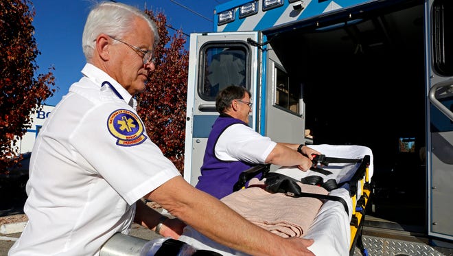 Lead paramedic John Reese, left, and paramedic supervisor Matt Moon, show the equipment used inside one of the ambulances on Monday at the San Juan Regional Medical Center Emergency Medical Services headquarters in Farmington.