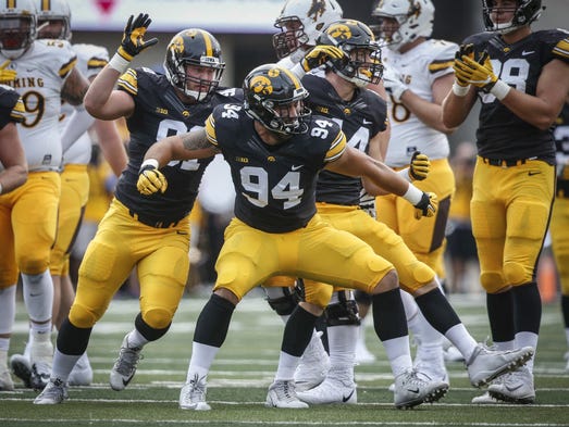 Iowa freshman defensive end A.J. Epenesa reacts after