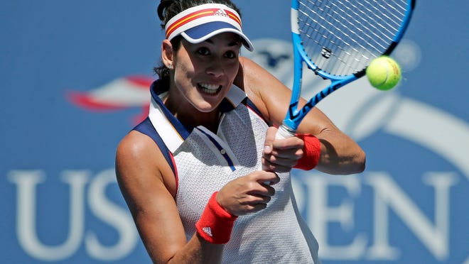 Garbine Muguruza, of Spain, returns a shot from Varvara Lepchenko, of the United States, during the first round of the U.S. Open tennis tournament, Monday, Aug. 28, 2017, in New York. (AP Photo/Seth Wenig)