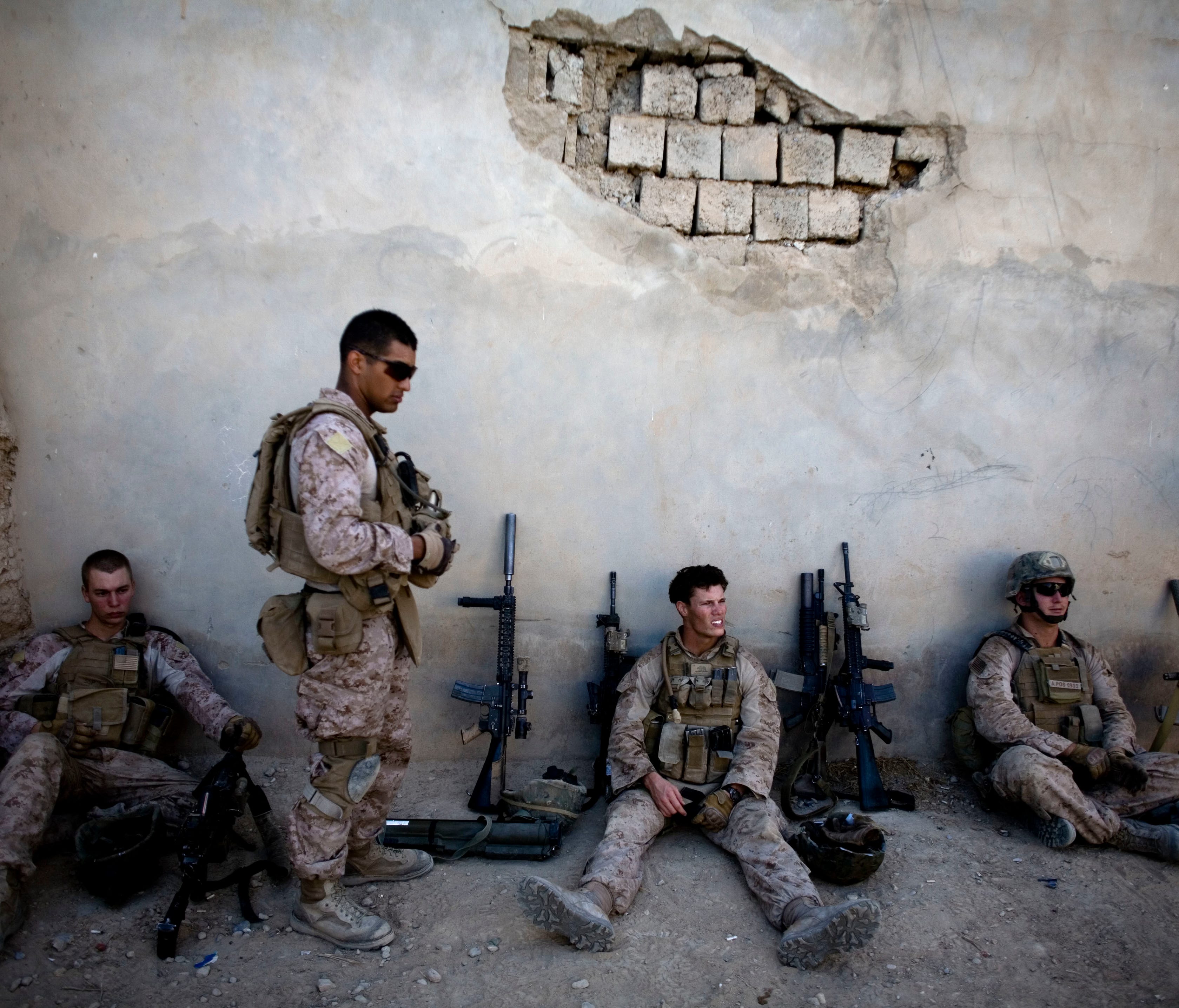 In this Nov. 3, 2011 file photo, Marines of with India company, 3rd Battalion 5th Marines, First Marine Division, take a break during a patrol in Sangin, south of Kabul, Afghanistan.