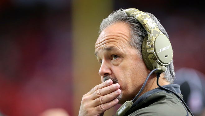 Indianapolis Colts head coach Chuck Pagano watches the replay on the stadium screen during the first half of an NFL football game Sunday, Nov. 22, 2015, at the Georgia Dome in Atlanta, Georgia.