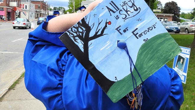 Murdock High graduates were recently honored with a parade down Central Street. The caps of many of the grads were decorated with unique artwork.