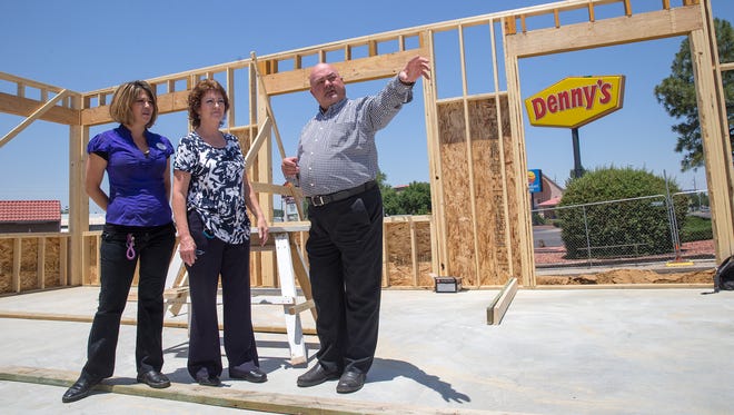 Denny's manager Patsy Hunt, left, general manager Eula Holmes and district leader Jim Coulter tour the construction site of the new Denny's location on Friday in Farmington.