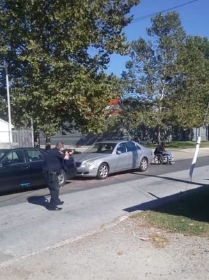 In this image taken from a cellphone video, Jeremy McDole is approached by Wilmington police in September 2015. Prosecutors said charges would not be filed against four officers involved in the shooting death of McDole.