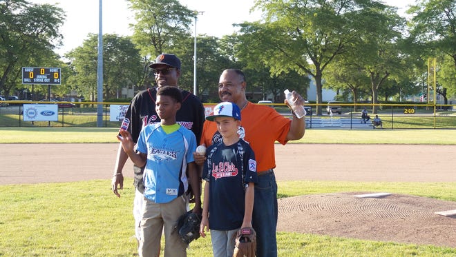 UAW Vice President Jimmy Settles, left, and former Detroit Tiger Willie Horton, right, on Thursday night before a youth league all-start game.
