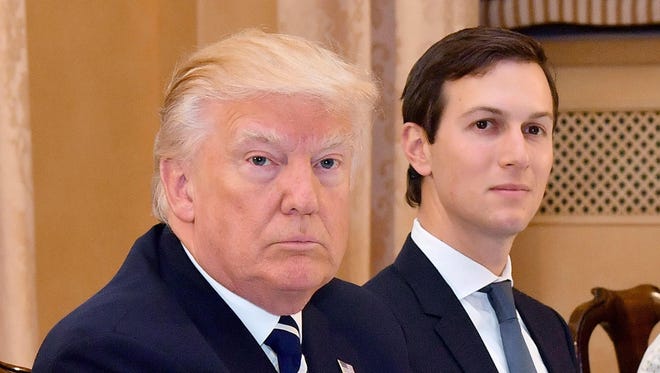 President Trump is flanked by senior adviser and son-in-law Jared Kushner during a meeting with Italian Prime Minister Paolo Gentiloni at Villa Taverna in Rome May 24.