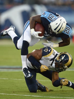 Titans running back Bishop Sankey gains yards against the Rams in the first quarter at Nissan Stadium on Sunday.