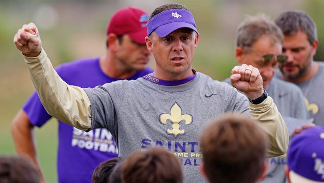 Scottsdale Notre Dame Prep football coach Mark Nolan works with his team on Tuesday, June 9, 2015.