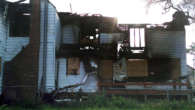 This 2014 photo provided by Jaclyn Bentley' shows the burned remains of her home in Clinton, Iowa. Bentley was acquitted in February 2017 of arson and insurance fraud charges, which she said stemmed from a flawed analysis of cellphone tower records.