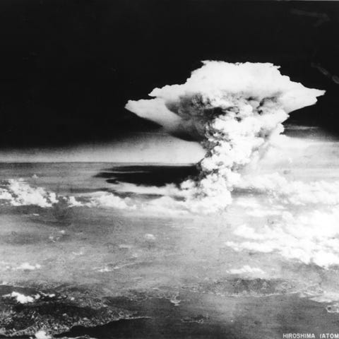 A mushroom cloud of the atomic bomb dropped by...