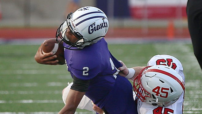 Center Grove's Dan Root (45) and the Trojans will key on Ben Davis QB Reese Taylor (2) in Friday's 6A semistate showdown.