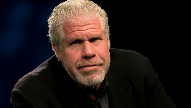 
In this Sept. 30, 2014 photo, actor Ron Perlman poses before an interview in New York. Perlman, 64, has been kicking around Hollywood for 30-plus years, racking up more than 200 credits in theater, film, TV and voice work thanks to his signature growly demeanor. Now, he’s the proud owner of a revealing memoir, “Easy Street (The Hard Way),” co-written by Michael Largo with a foreword by one of his enablers, filmmaker Guillermo del Toro. 
