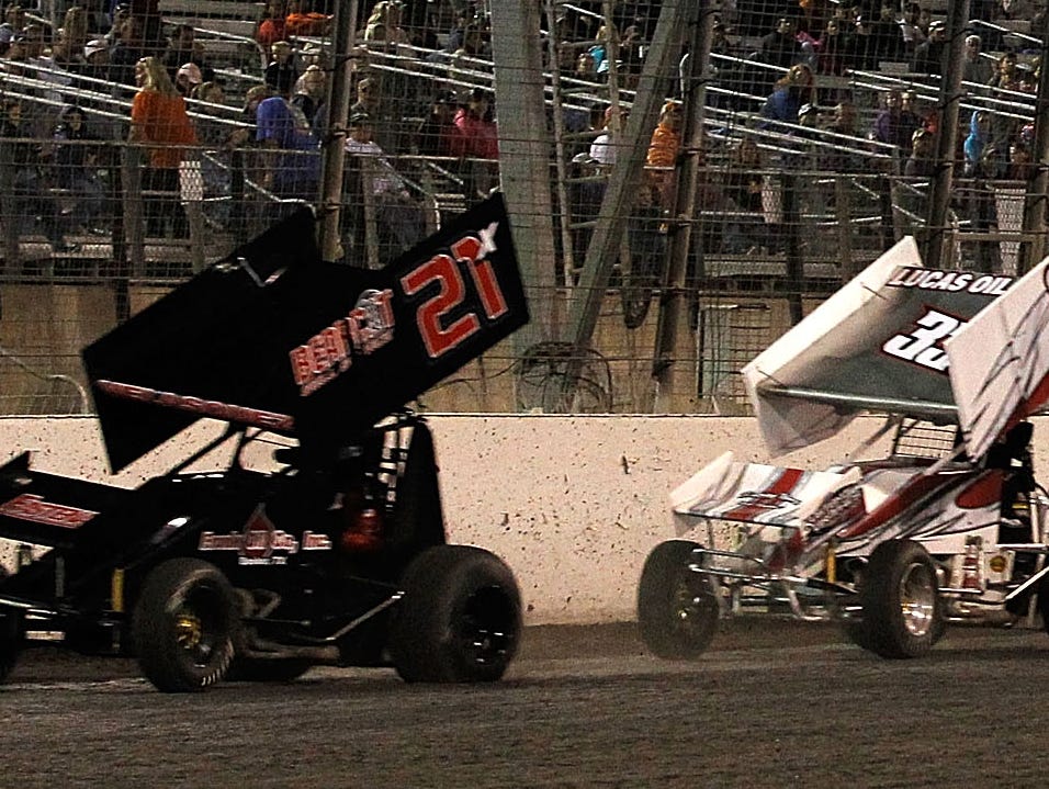 Sprint cars are shown competing at Texas Motor Speedway in 2014. (Mike Stone/Getty Images for Texas Motor Speedway)