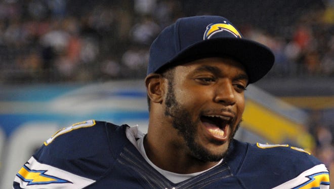 San Diego Chargers outside linebacker Dwight Freeney (93) jokes around on the sidelines during the fourth quarter against the Dallas Cowboys at Qualcomm Stadium, Aug. 7, 2014.