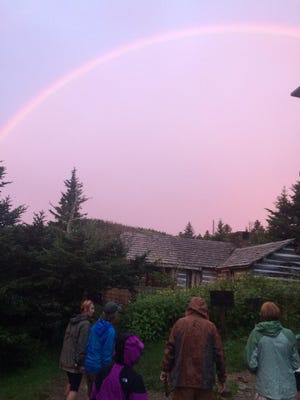 A rainbow arches across the sky at Mount LeConte Lodge in Great Smoky Mountains National Park. The lodge, only accessible by foot, is the highest in the Eastern United States.