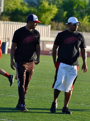 Airabin Justin (right), who works as a defensive backs coach at various high schools in the Valley, finally gets a chance to lead his own football program.