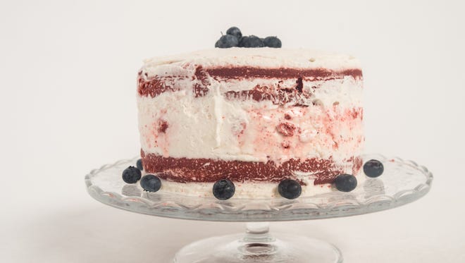 Red velvet ice cream cake topped with blueberries on Friday, June 29, 2018.