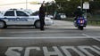 Police control a road near the Marjory Stoneman Douglas