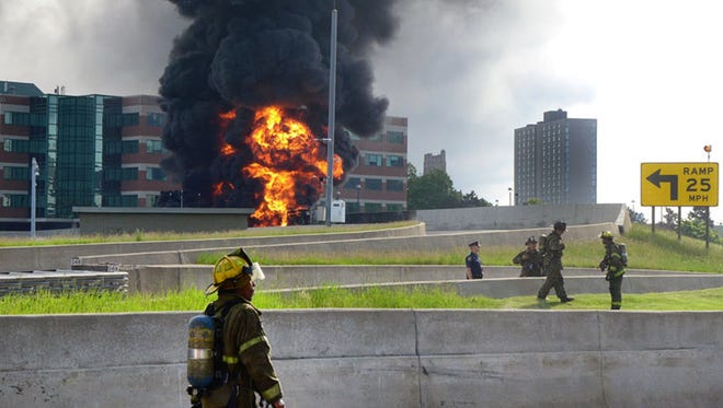 Detroit fireman respond May 24, 2015, to an explosion and tanker fire on northbound Interstate 75 in Detroit. The driver of the tanker was able to escape the explosion with no injuries.