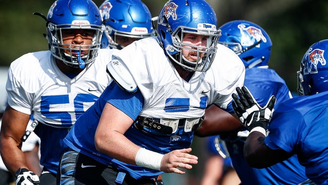 University of Memphis offensive lineman Drew Kyser (middle) during spring football practice. 