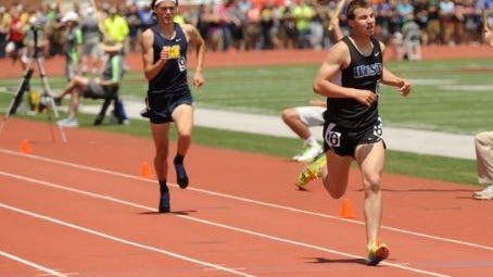 Oshkosh West’s Jake Rost sprints to the finish in the Division 1 1,600 meters on Saturday.