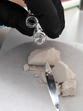 Suspected heroin is tested in a crime laboratory.