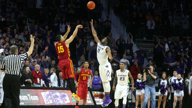 Kansas State Wildcats forward Nino Williams (11) attempts to block the shot by Iowa State Cyclones guard Naz Long (15) during the Wildcats' 70-69 win at Fred Bramlage Coliseum.