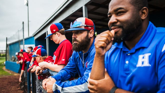 May 24, 2017 - Harding Academy coach Josh Stevens, middle, and trainer Carlos Dowell watch their team compete against St. George's in the 2017 TSSAA Division II Class A State Baseball Tournament at La Vergne High School in Smyrna, TN on Wednesday afternoon. Harding defeated St. George's 5-1.