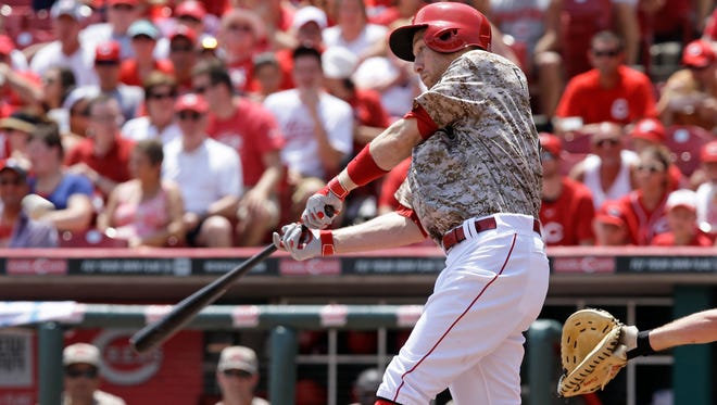 The Reds' Todd Frazier hits a two-run home run in the fifth inning Sunday.