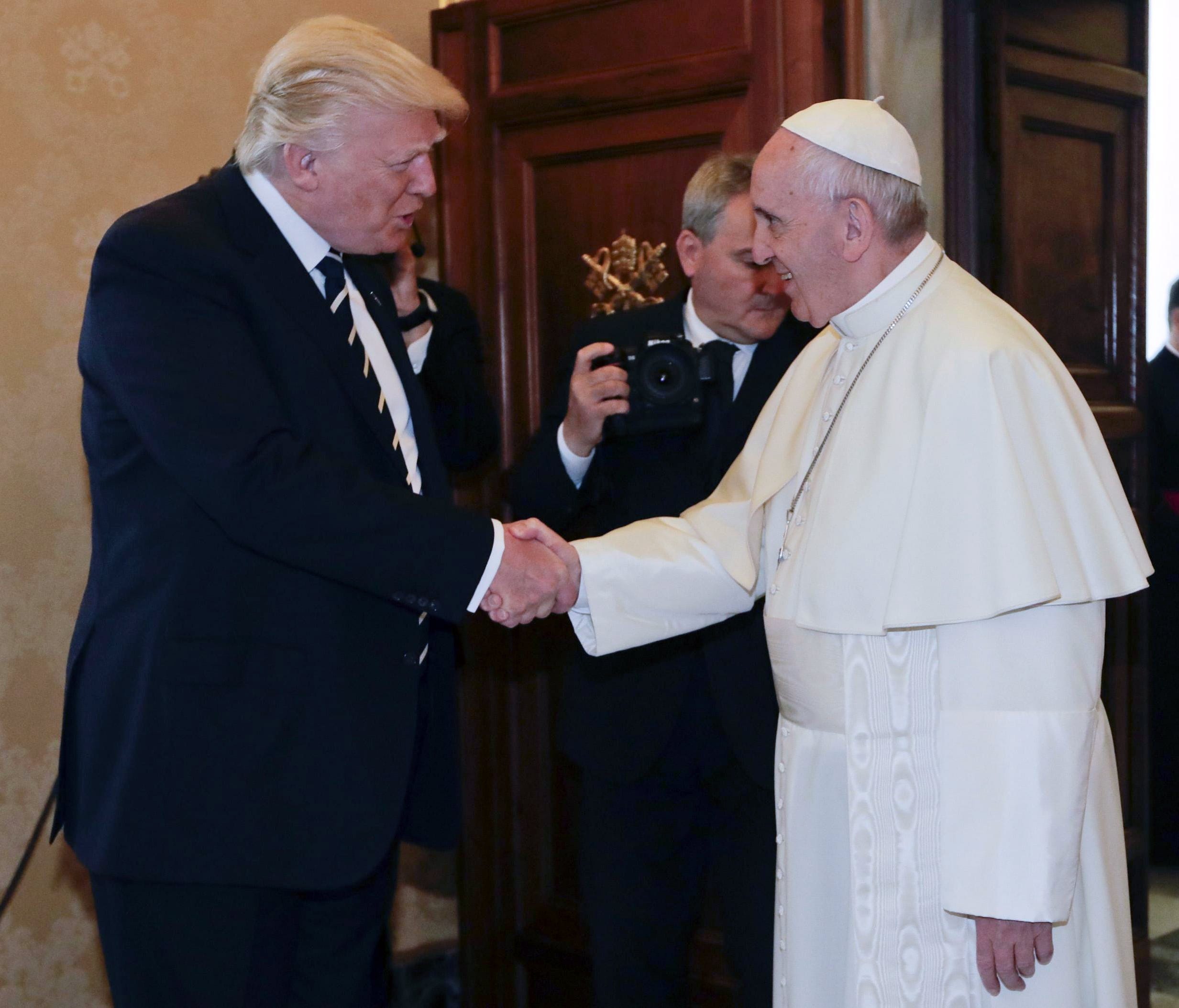 Pope Francis shakes hands with President Trump on the occasion of their private audience at the Vatican in Vatican City, May 24, 2017.