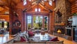 Crafted with Rocky Mountain logs, the custom home once