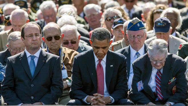 President Barack Obama attends a ceremony in Colleville-sur-Mer, France, to mark the 70th anniversary of D-Day in 2014.