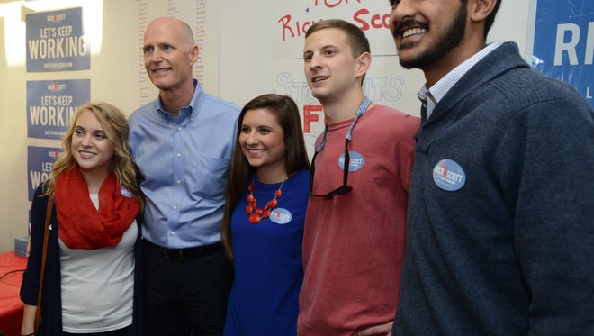 Gov. Rick Scott meets with supporters at the Republican headquarters building off North Ninth Ave. on Election Day Tuesday at about 4:30 p.m.