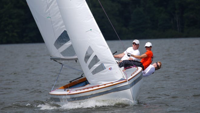 Bruce and Debbie Busbey and their crew won the Highlander Class national championship July 10-13 at Berlin Reservoir in Ohio.