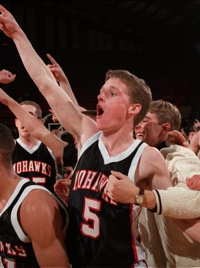 1996: Mason City's Dean Oliver (left) and Steve Locher (middle) celebrate with their team after defeating Iowa City West for the Class 4-A state championship.