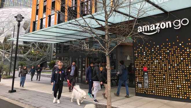 The Amazon Go convenience store at Amazon's headquarters in Seattle. It features Just Walk Out technology, which allows shoppers who have the Amazon Go app to walk in, grab what they want, and walk out - all without going through a checkout line. The costs are automatically charged to their account.