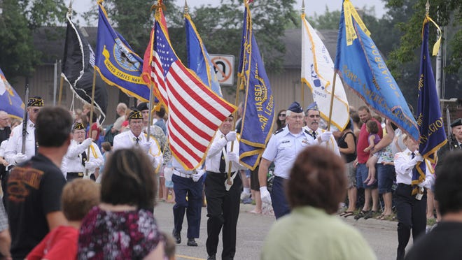 The Color Guard leads the parade in Rice.