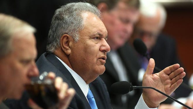 Mori Hosseini asks a question during a Board of Governors meeting in this undated file photo.