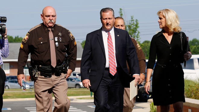 Mike Hubbard and wife Susan Hubbard walk to the Lee County Justice Center for day three of Hubbards trial trial on Thursday, May 26, 2016  in Opelika, Ala. Hubbard faces felony ethics charges accusing him of using his political positions to obtain $2.3 million in work and investments.  (Todd J. Van Emst/Opelika-Auburn News via AP, Pool)