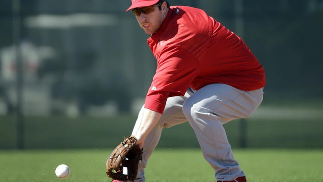 St. Louis' Jedd Gyorko handles a grounder during spring training. Before Jhonny Peralta was sidelined with a thumb injury, Gyorko had been preparing to be a starter for the Cardinals.