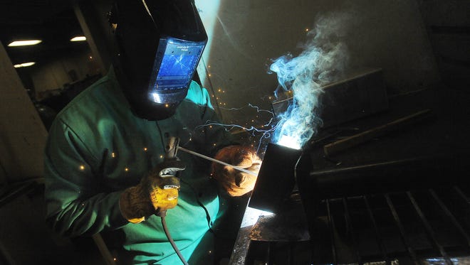 Subash Ahangkari practices stick welding   during a class by Training Solutions Institute at Southeast Technical Institute on Sat., Feb. 13, 2016.
