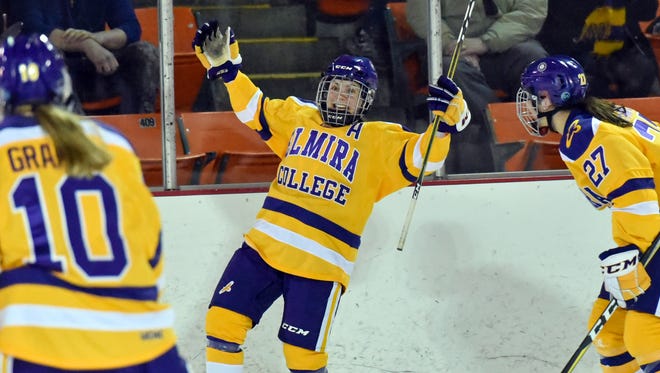 Maddy Evangelous celebrates her empty-net goal Saturday during Elmira College's 2-0 NCAA quarterfinal win over Adrian at the Murray Athletic Center.
