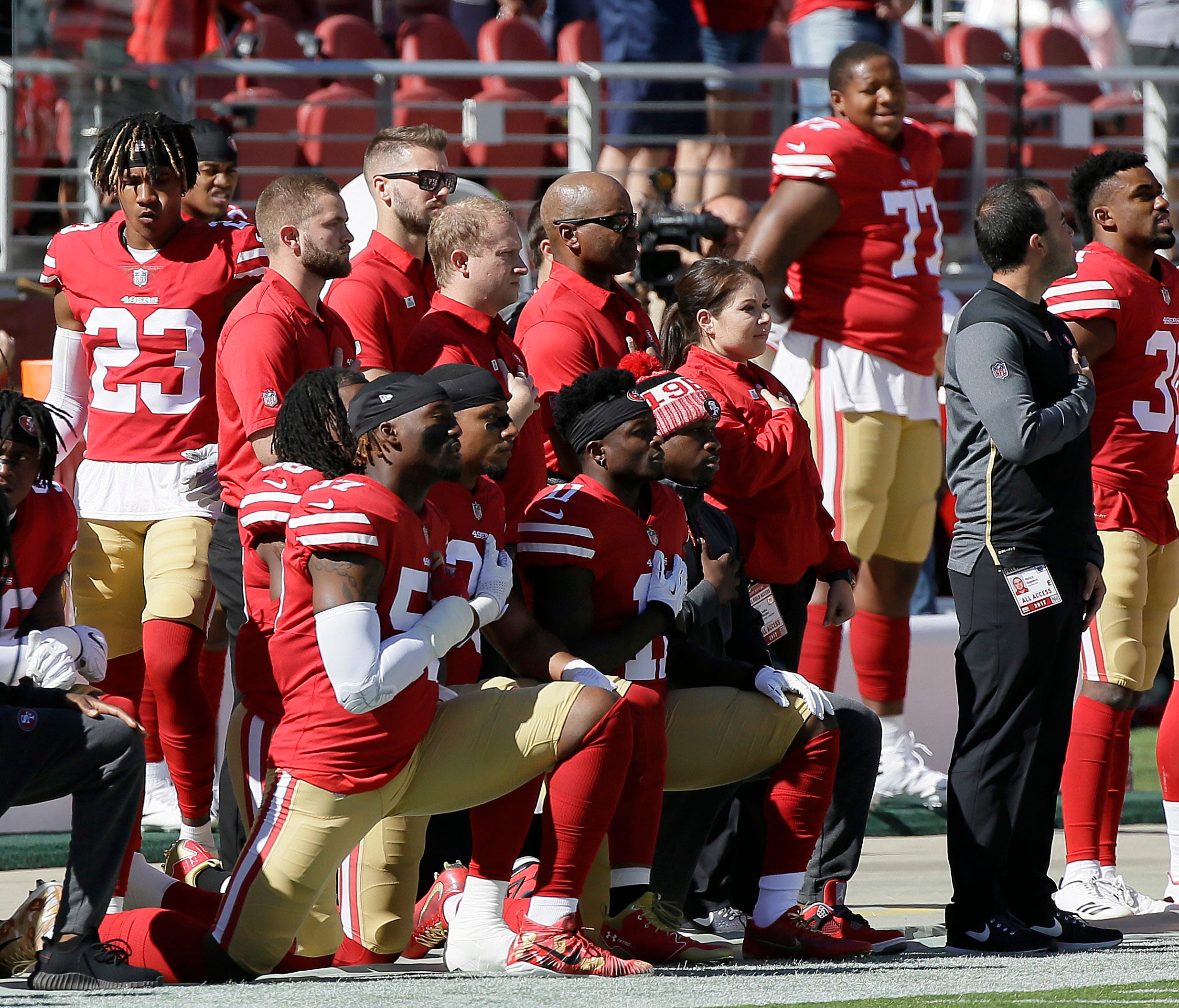 San Francisco 49ers players kneel during the performance of the national anthem before an NFL football game between the 49ers and the Dallas Cowboys in Santa Clara, Calif., Sunday, Oct. 22, 2017.